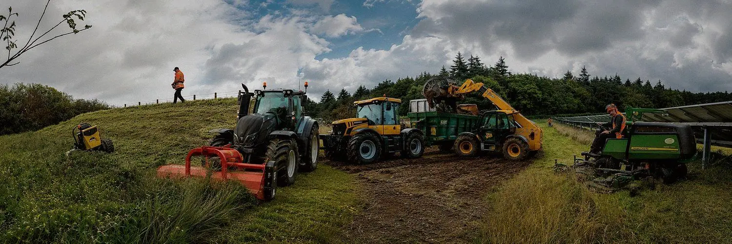 PG Groundcare fleet on site: tractor and flail, telehandler, trailer, ride-on mower and a remote-controlled slope mower working a bank