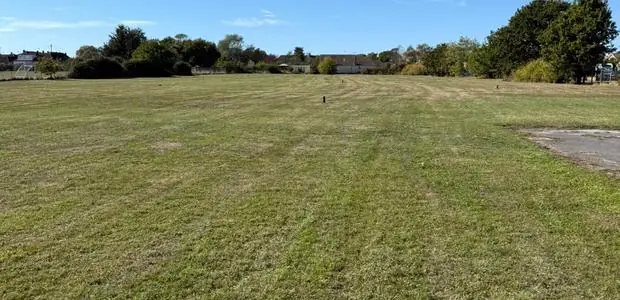 Large site cut through and left clean, grass striped to the boundary